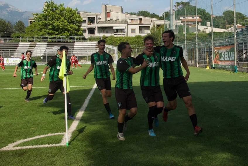 Soccer players celebrating a goal at the Lazio Cup