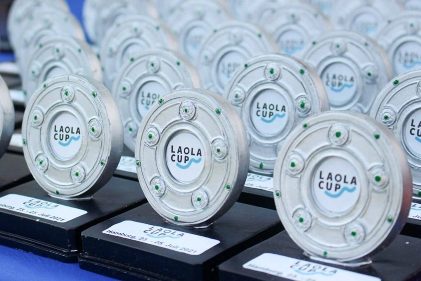 Laola Cup trophies arrayed at soccer tournament