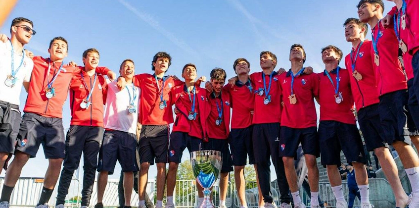 Youth football team with medals at Porto International Cup tournament