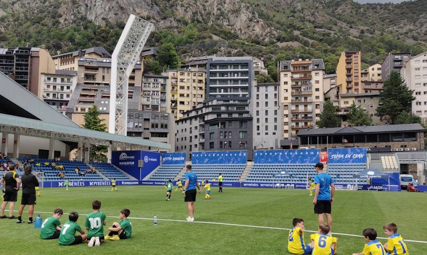 Youth soccer team taking a break on the field at Copa Andorra event
