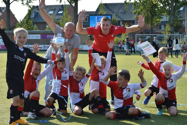 Children's soccer team with trophy at Walibi Cup tournament in June