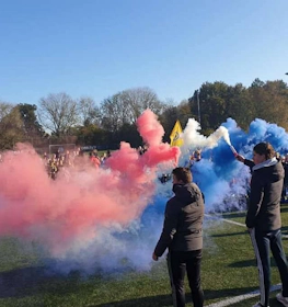 Oostduinkerke Cup football tournament celebration with colorful smoke on the field