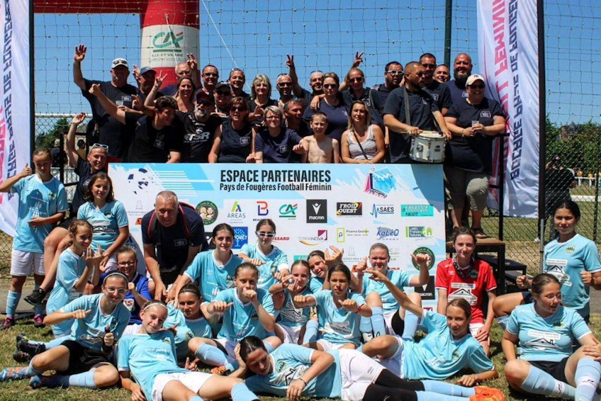 Girls' soccer team at Girl's Game Tournament in the US with trophy